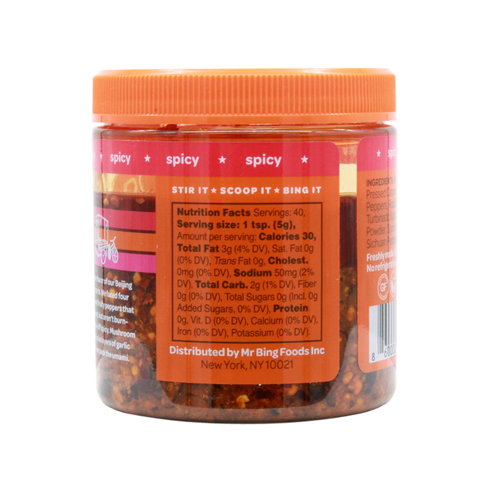 Two 7oz jars of Mr Bing Chili Crisp from Mr Bing Foods, showcasing the spicy chili paste with a textured surface.