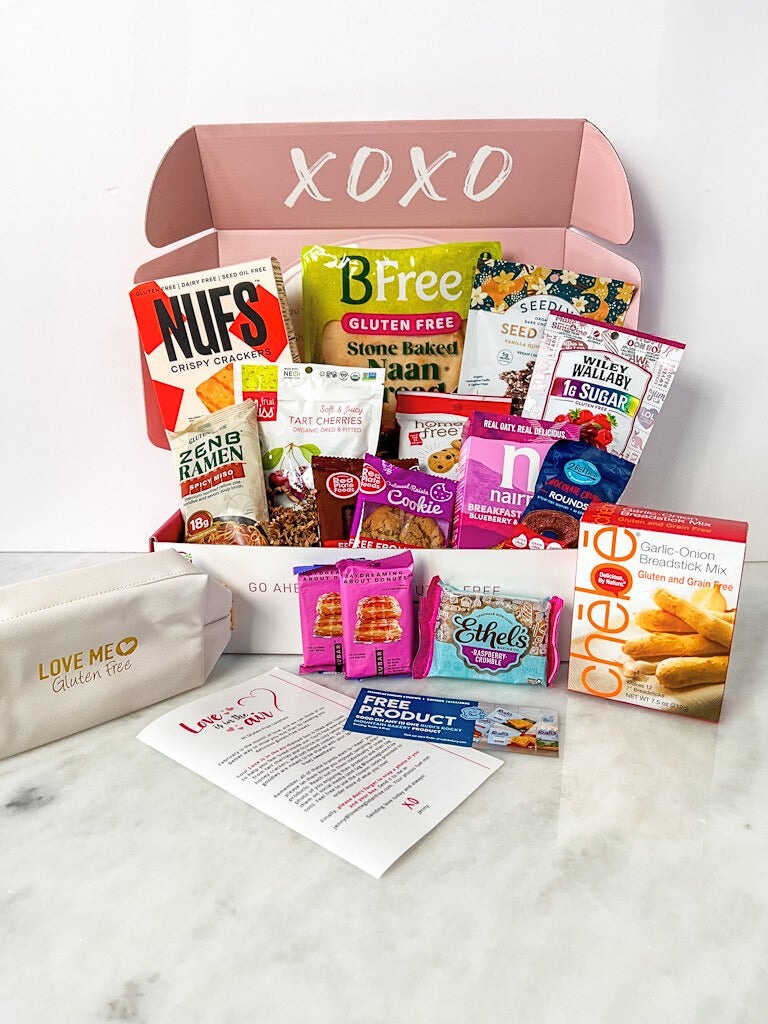 Dairy-free and gluten-free monthly subscription box from Love Me Gluten Free with assorted snacks and treats for February 2025.