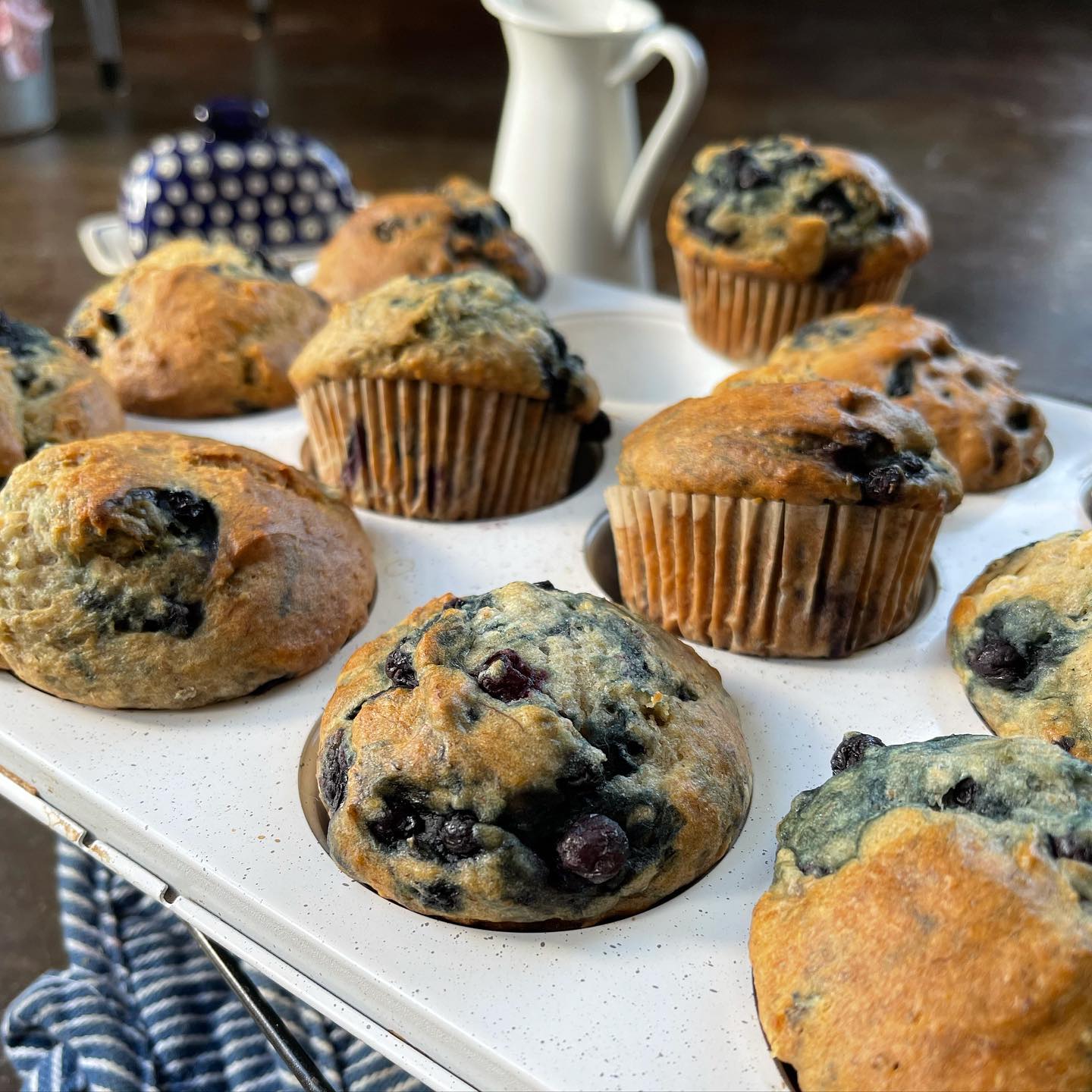Gluten-free blueberry banana muffins made with gfJules muffin mix, showing freshly baked muffins with blueberries and banana slices.