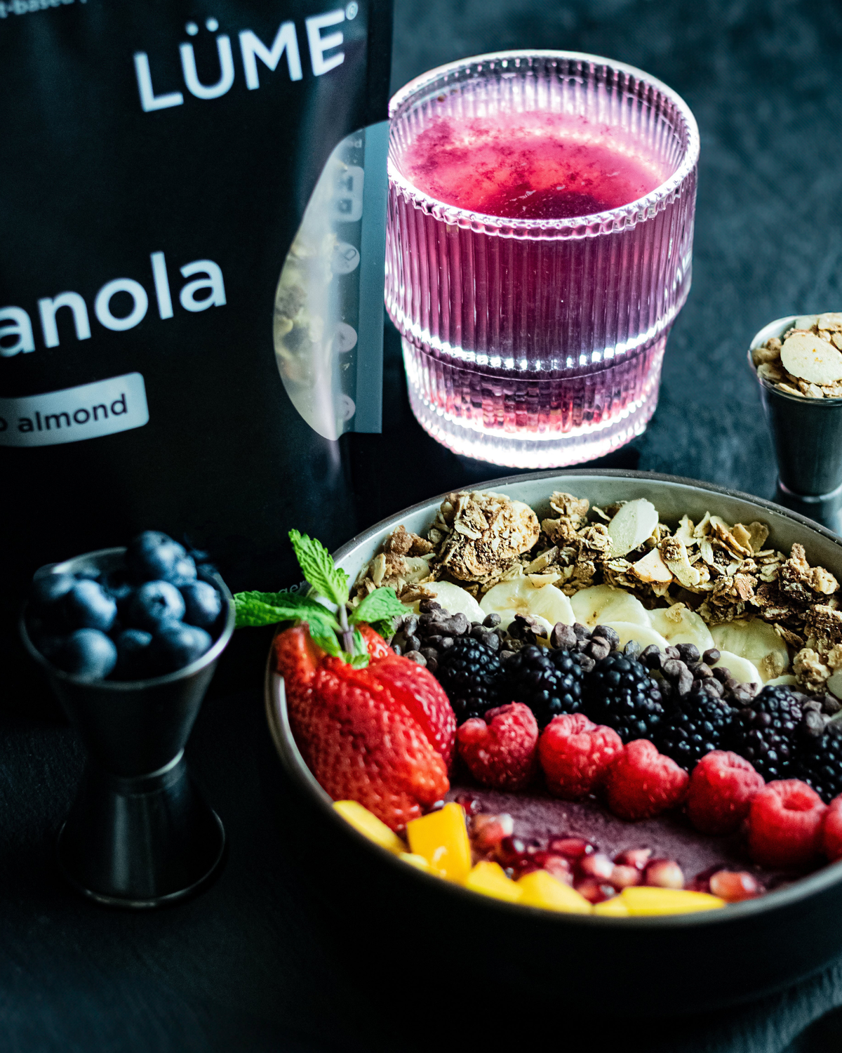 LÜME Cacao Almond Granola with crunchy oats, almonds, and cacao pieces displayed in packaging