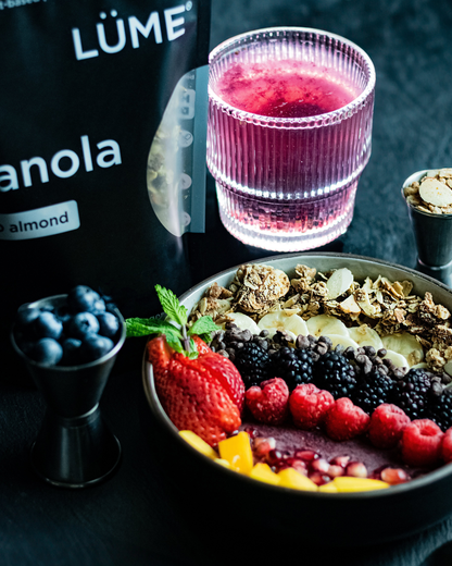 LÜME Cacao Almond Granola with crunchy oats, almonds, and cacao pieces displayed in packaging