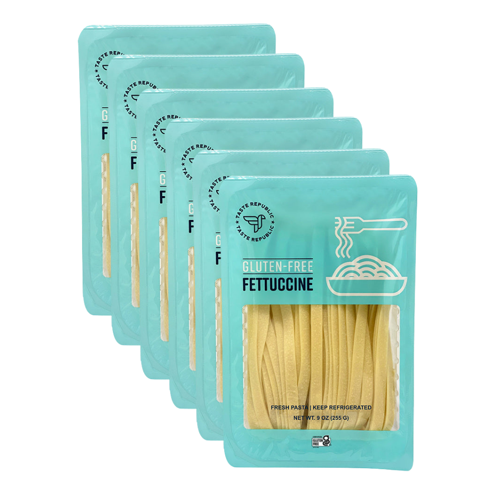 Taste Republic gluten-free fettuccine pasta in a 6-pack, showcasing fresh, uncooked gluten-free pasta noodles.