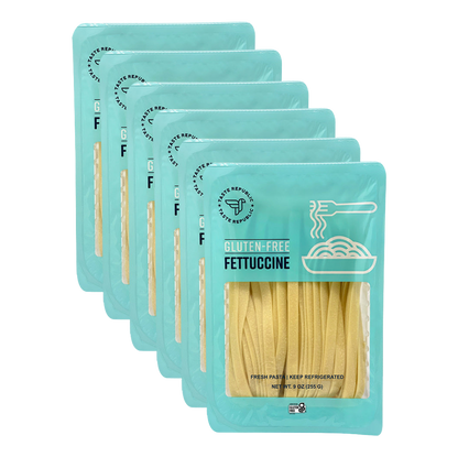 Taste Republic gluten-free fettuccine pasta in a 6-pack, showcasing fresh, uncooked gluten-free pasta noodles.