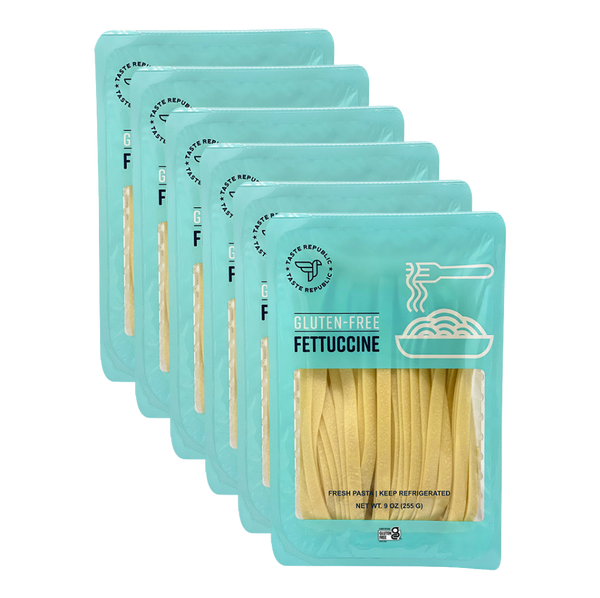 Taste Republic gluten-free fettuccine pasta in a 6-pack, showcasing fresh, uncooked gluten-free pasta noodles.