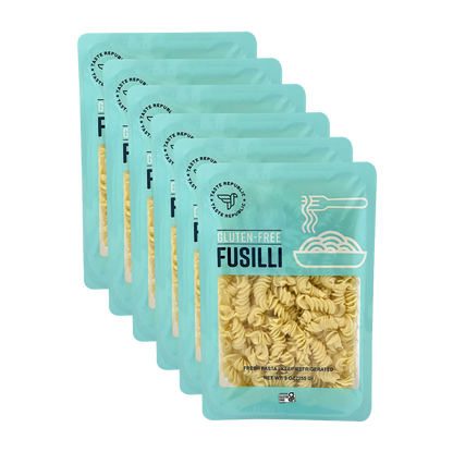 Taste Republic gluten-free fusilli pasta in a 6-pack, showing uncooked gluten-free pasta spirals on a white background.