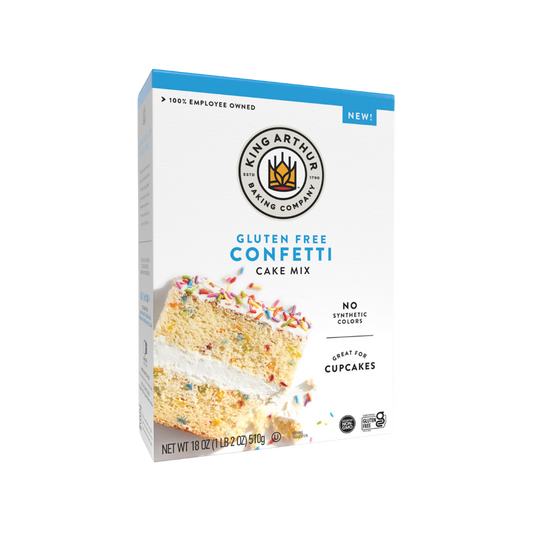 King Arthur Confetti Cake Mix in a colorful box with a prepared cake topped with confetti sprinkles.