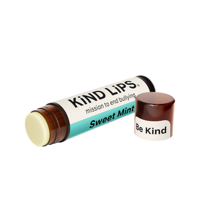 Kind Lips Sweet Mint Organic Lip Balm in a small container with mint-flavored lip balm visible inside.