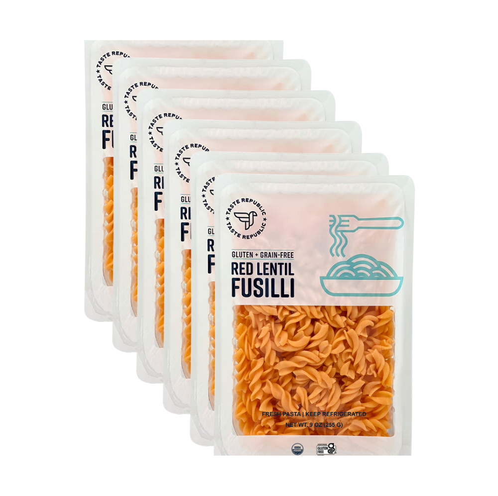 Taste Republic gluten-free red lentil fusilli pasta in organic 6-pack, showing uncooked grain-free red lentil pasta spirals.