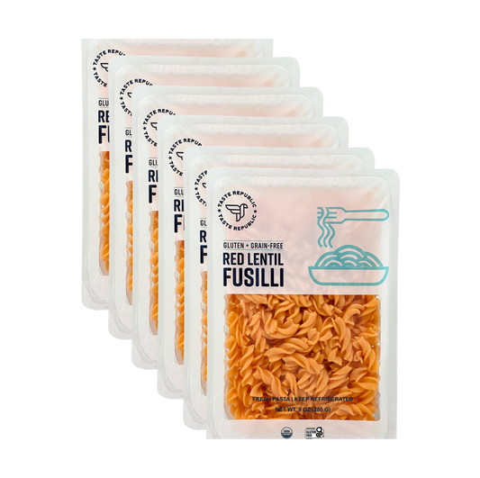 Taste Republic gluten-free red lentil fusilli pasta in organic 6-pack, showing uncooked grain-free red lentil pasta spirals.