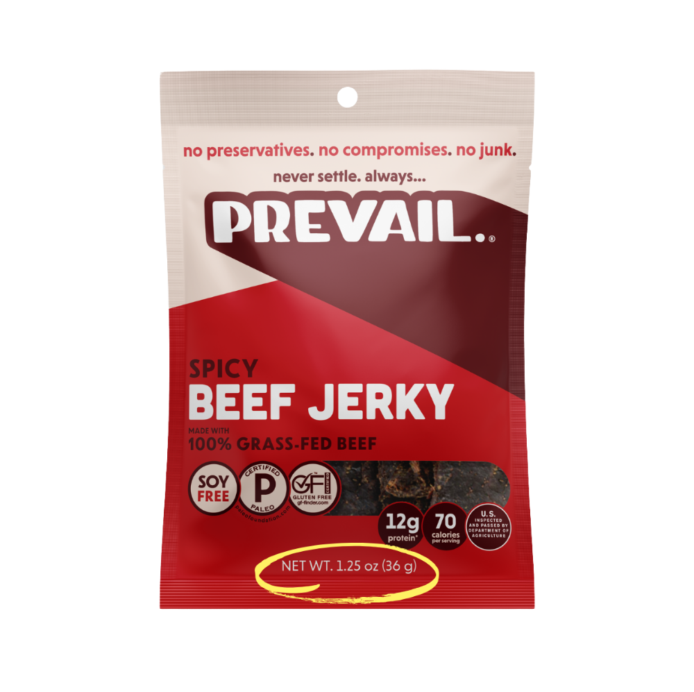 Spicy beef jerky from PREVAIL Jerky, single-serve pack with 8 pieces, showing flavorful, seasoned beef jerky on a white background.