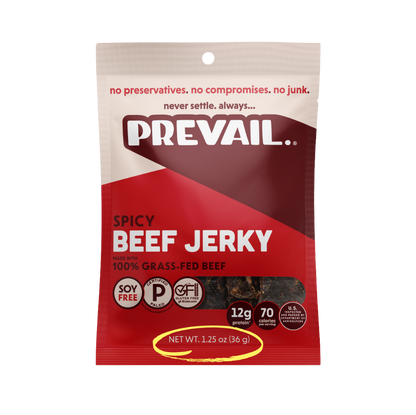 Spicy beef jerky from PREVAIL Jerky, single-serve pack with 8 pieces, showing flavorful, seasoned beef jerky on a white background.