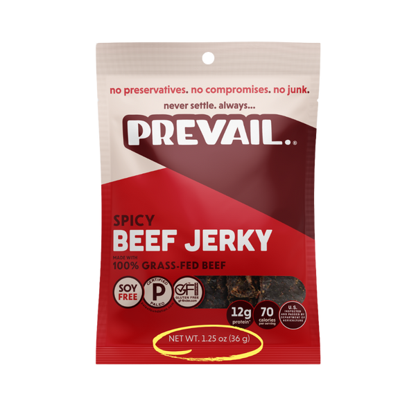 Spicy beef jerky from PREVAIL Jerky, single-serve pack with 8 pieces, showing flavorful, seasoned beef jerky on a white background.
