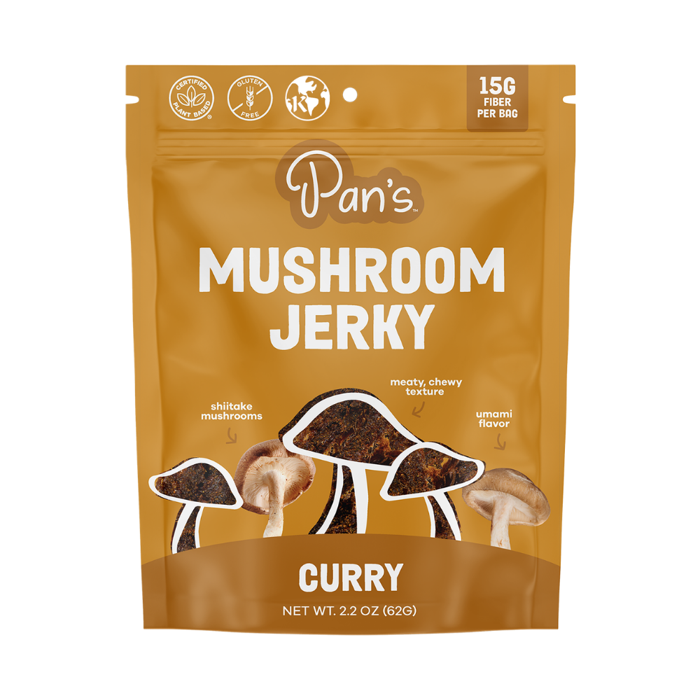 Pan's Mushroom Jerky Curry Mushroom Jerky close-up showing dried mushroom slices with curry seasoning on a white background.