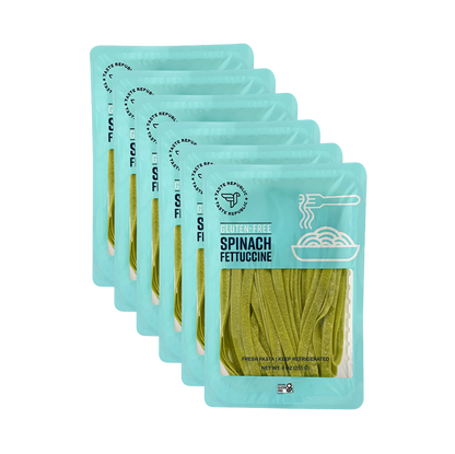 Taste Republic gluten-free spinach fettuccine pasta in a 6-pack, showing the fresh green pasta strips on a white background.