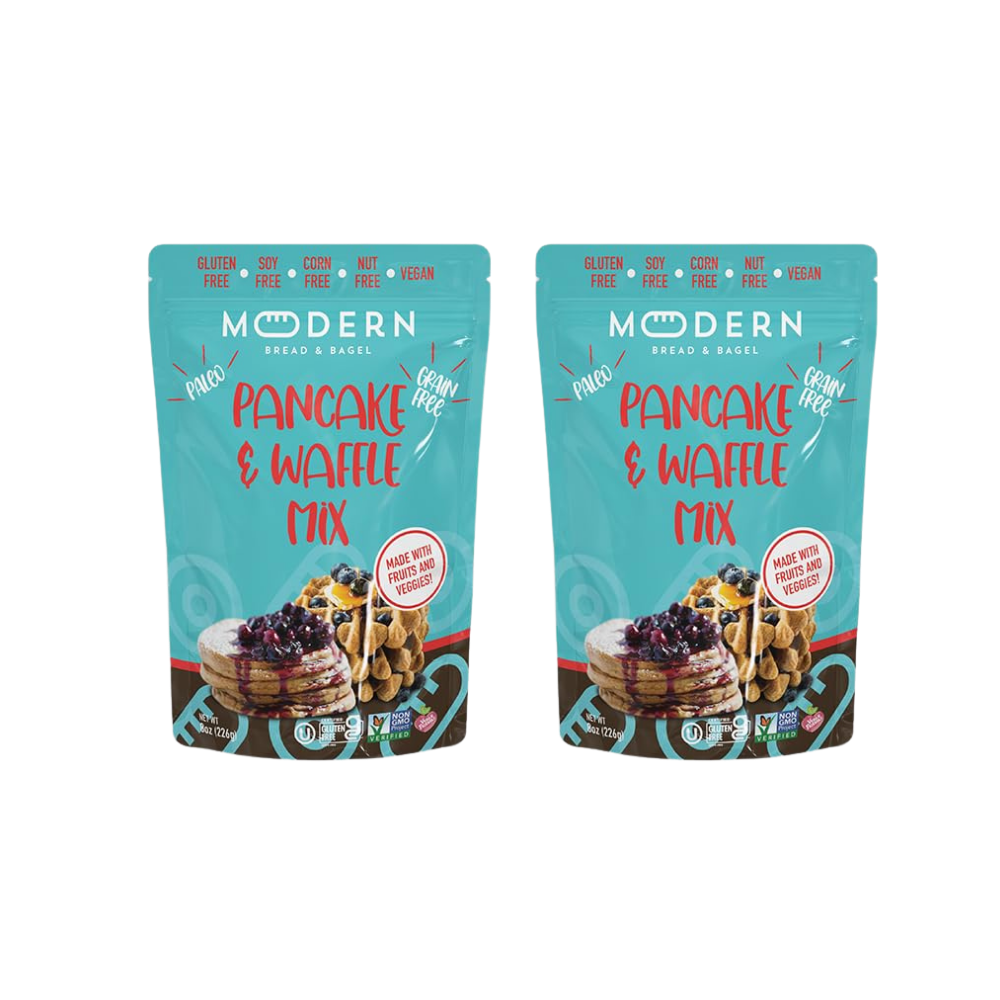 Modern Bread & Bagel pancake and waffle mix package with images of prepared pancakes and waffles on a wooden table.