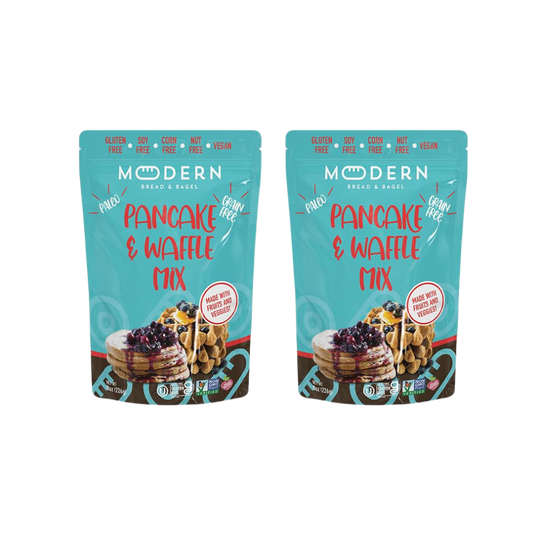 Modern Bread & Bagel pancake and waffle mix package with images of prepared pancakes and waffles on a wooden table.