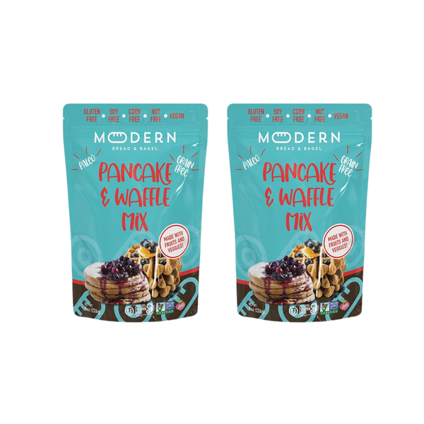 Modern Bread & Bagel pancake and waffle mix package with images of prepared pancakes and waffles on a wooden table.