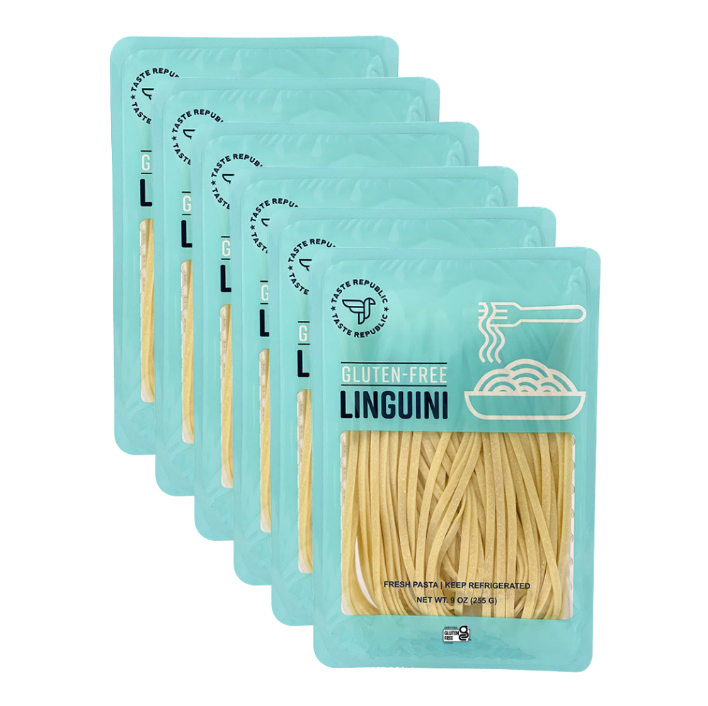 Fresh gluten-free linguini pasta from Taste Republic Gluten-Free, shown in a 6-pack carton with uncooked pasta strands.