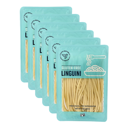 Fresh gluten-free linguini pasta from Taste Republic Gluten-Free, shown in a 6-pack carton with uncooked pasta strands.