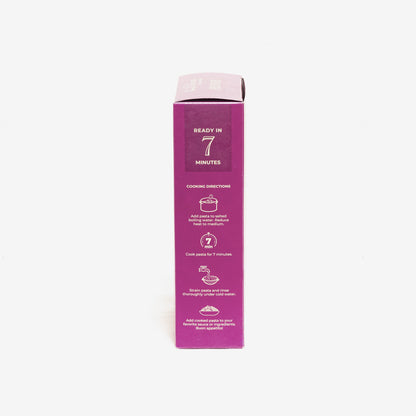 Side view of a single artisanal gluten-free, high-protein pasta penne from Flower Chef Foods in a 6-pack.