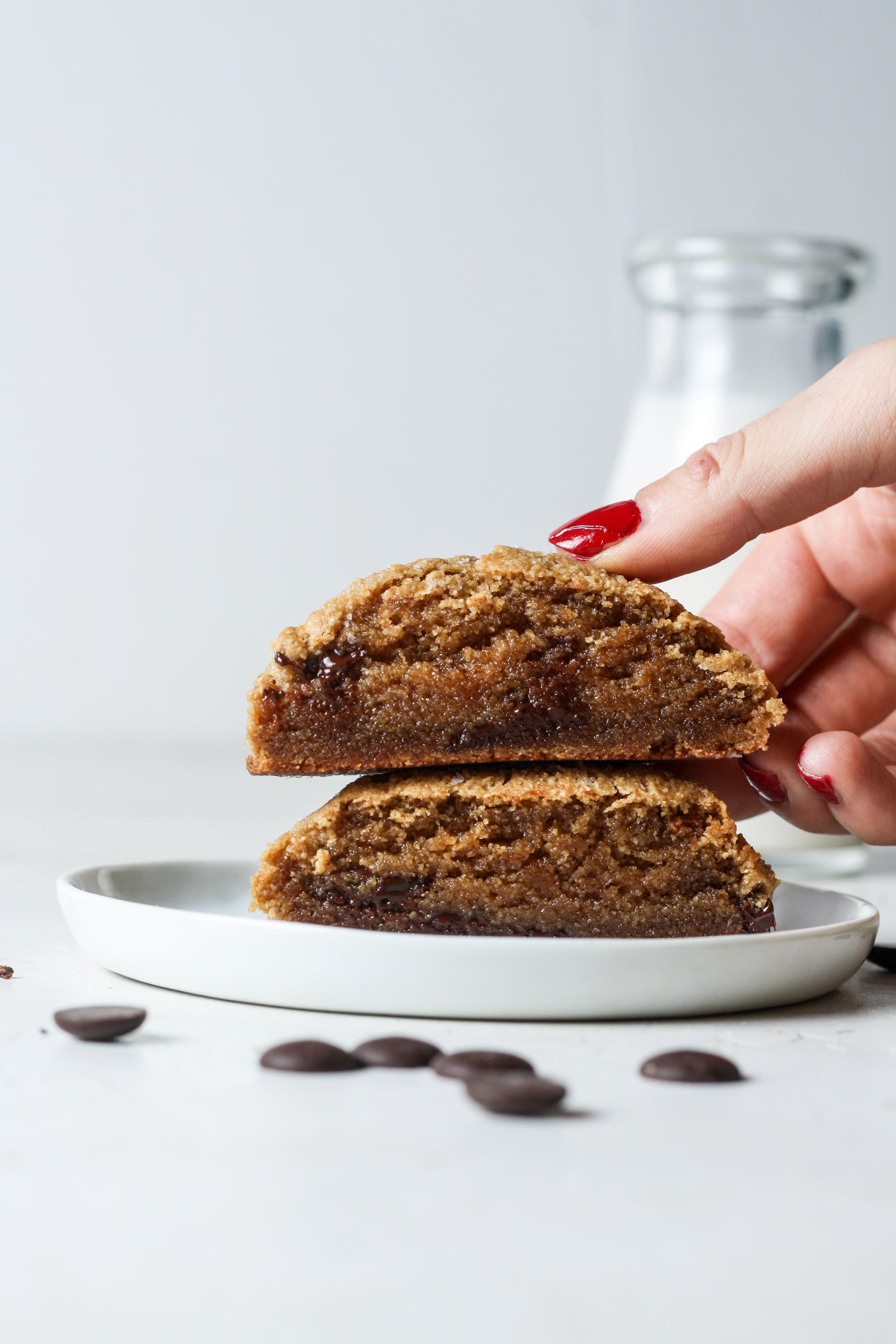 Sweet Addison's vegan chocolate chip cookies on a plate, showcasing golden-brown cookies with chocolate chips