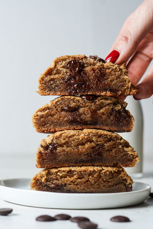 Vegan chocolate chip cookies from Sweet Addison's, fresh baked with chocolate chips, displayed on a plate.