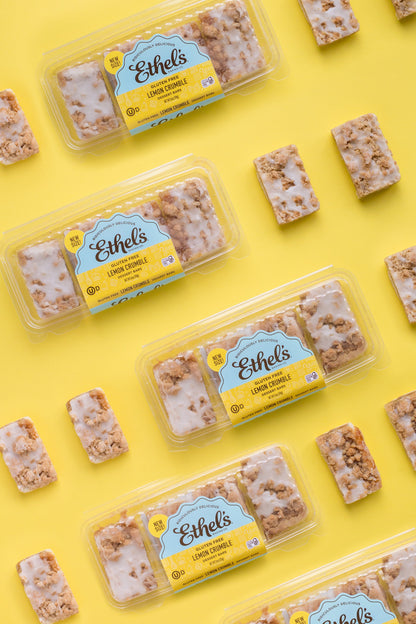 Ethel's Lemon Crumble Bar from Ethels Baking Company, close-up of a golden lemon crumble bar with lemon zest topping.