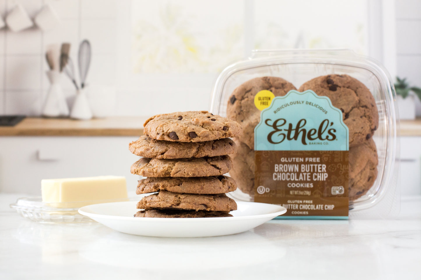 Ethel's Baking Company brown butter chocolate chip cookies on a plate, showcasing golden-brown cookies with chocolate chips.