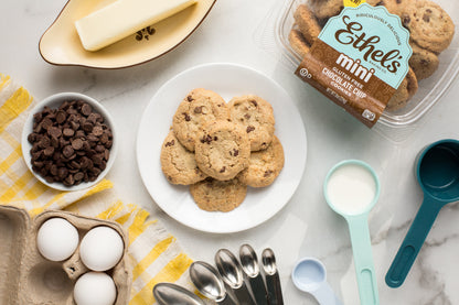 Two mini chocolate chip cookies from Ethel's Baking Company on a white plate, showcasing golden-brown cookies with chocolate chips.