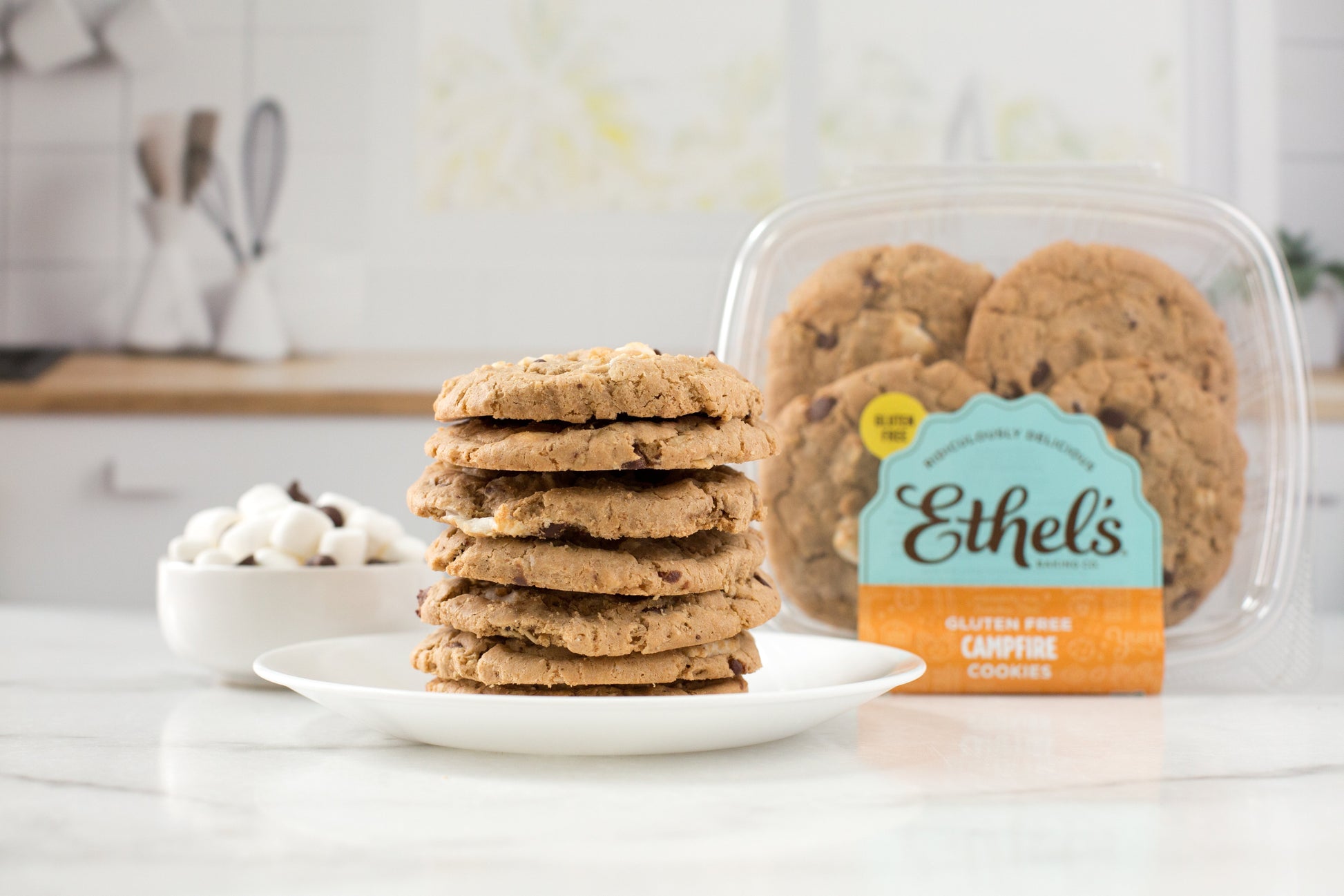 Ethel's Campfire Cookies by Ethels Baking Company, fresh baked cookies with a golden-brown crust and chocolate chips on a rustic plate.