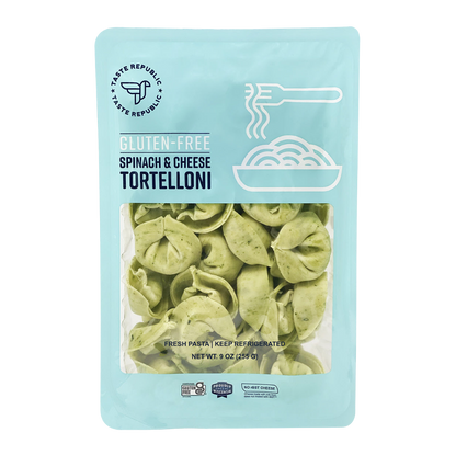 Taste Republic gluten-free spinach and cheese tortelloni pasta in a 6-pack, featuring fresh, uncooked tortelloni on a white background.