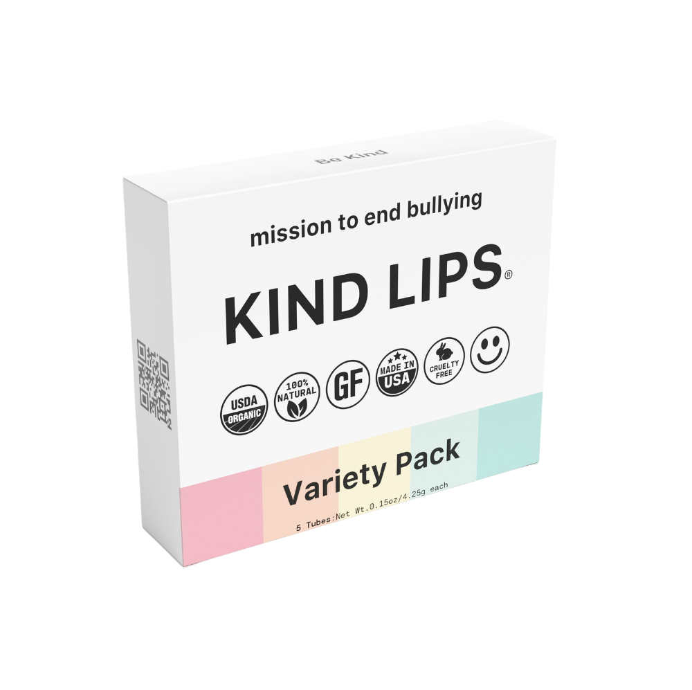 Set of five organic Kind Lips lip balms in assorted flavors with natural packaging, designed to moisturize and protect lips.