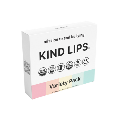 Set of five organic Kind Lips lip balms in assorted flavors with natural packaging, designed to moisturize and protect lips.