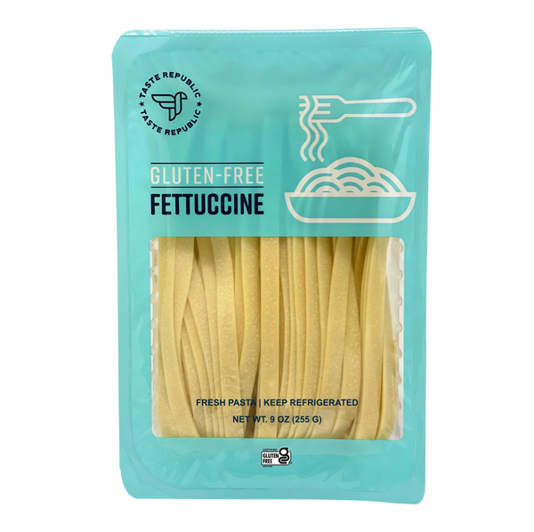 Taste Republic gluten-free fettuccine pasta pack with six servings, showcasing fresh, uncooked pasta strands in a clear container.