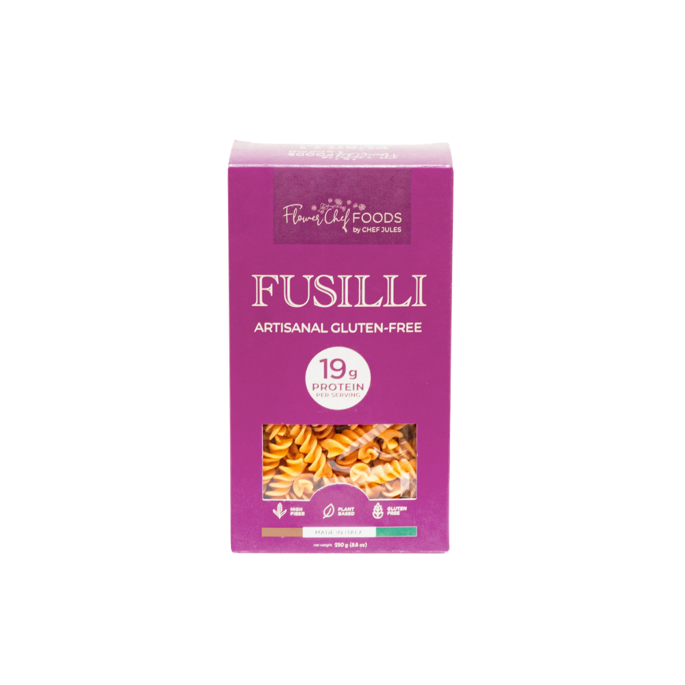 High protein Flower Chef Foods Fusilli pasta in a clear bowl, showcasing the spiral shape and vibrant color.