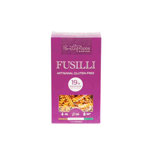 High protein Flower Chef Foods Fusilli pasta in a clear bowl, showcasing the spiral shape and vibrant color.