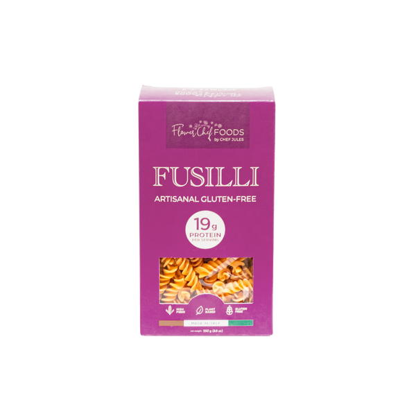 High protein Flower Chef Foods Fusilli pasta in a clear bowl, showcasing the spiral shape and vibrant color.