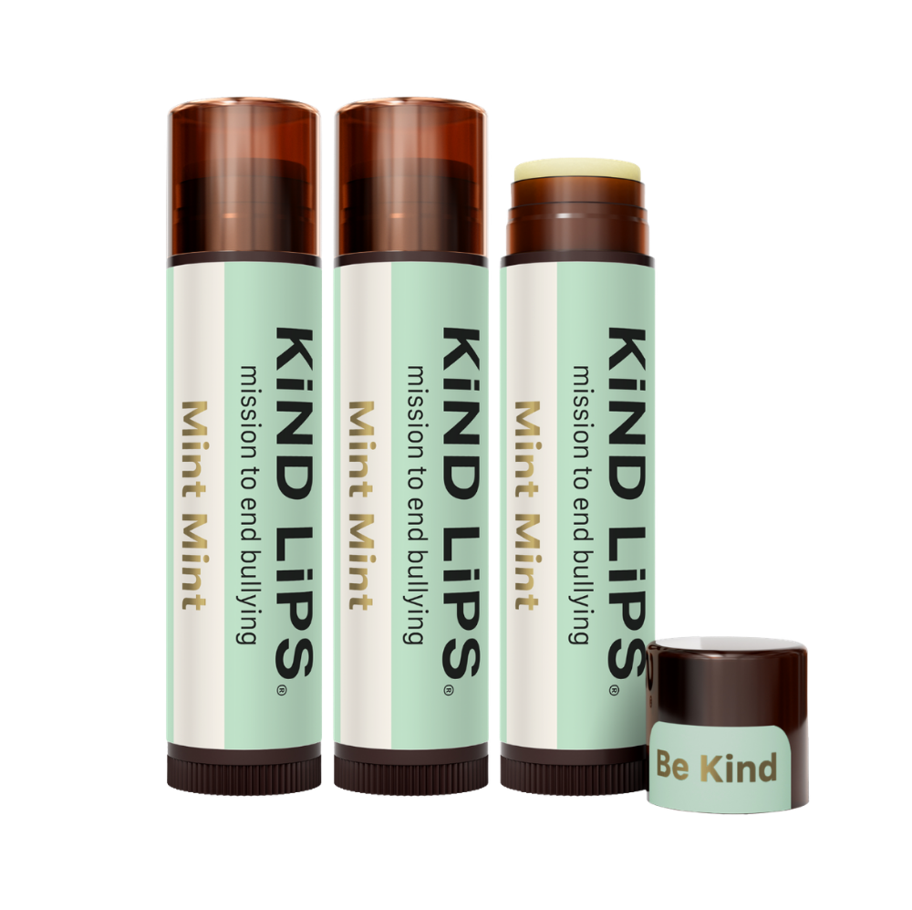 Kind Lips Mint Mint organic lip balm tube with clear packaging and mint flavor label, showcasing a nourishing lip care product.