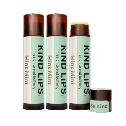 Kind Lips Mint Mint organic lip balm tube with clear packaging and mint flavor label, showcasing a nourishing lip care product.