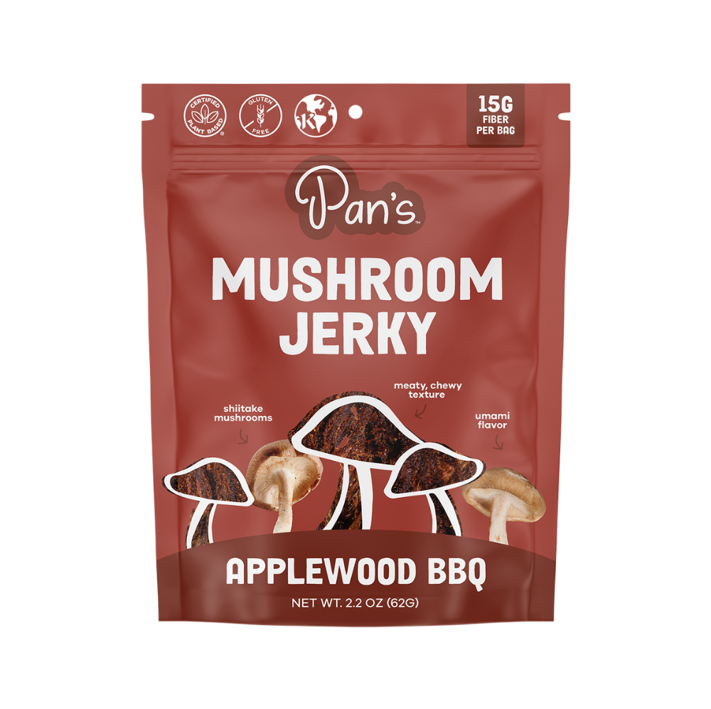 Pan's Mushroom Jerky Applewood BBQ flavor, close-up of savory mushroom jerky slices with smoky BBQ glaze, natural and flavorful.