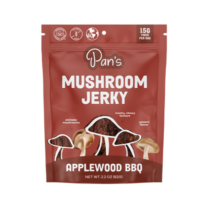 Pan's Mushroom Jerky Applewood BBQ flavor, close-up of savory mushroom jerky slices with smoky BBQ glaze, natural and flavorful.