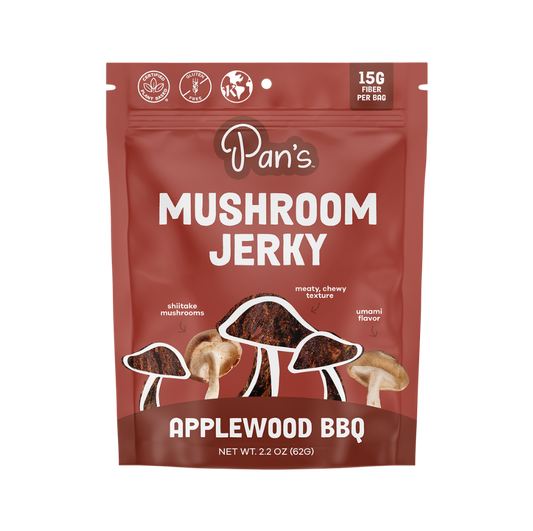 Pan's Mushroom Jerky Applewood BBQ flavor, close-up of savory mushroom jerky slices with smoky BBQ glaze, natural and flavorful.