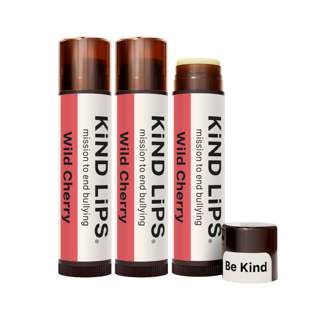 Kind Lips Wild Cherry Organic Lip Balm featuring a smooth, natural lip balm tube with cherry-flavored packaging and branding.