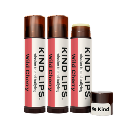 Kind Lips Wild Cherry Organic Lip Balm featuring a smooth, natural lip balm tube with cherry-flavored packaging and branding.