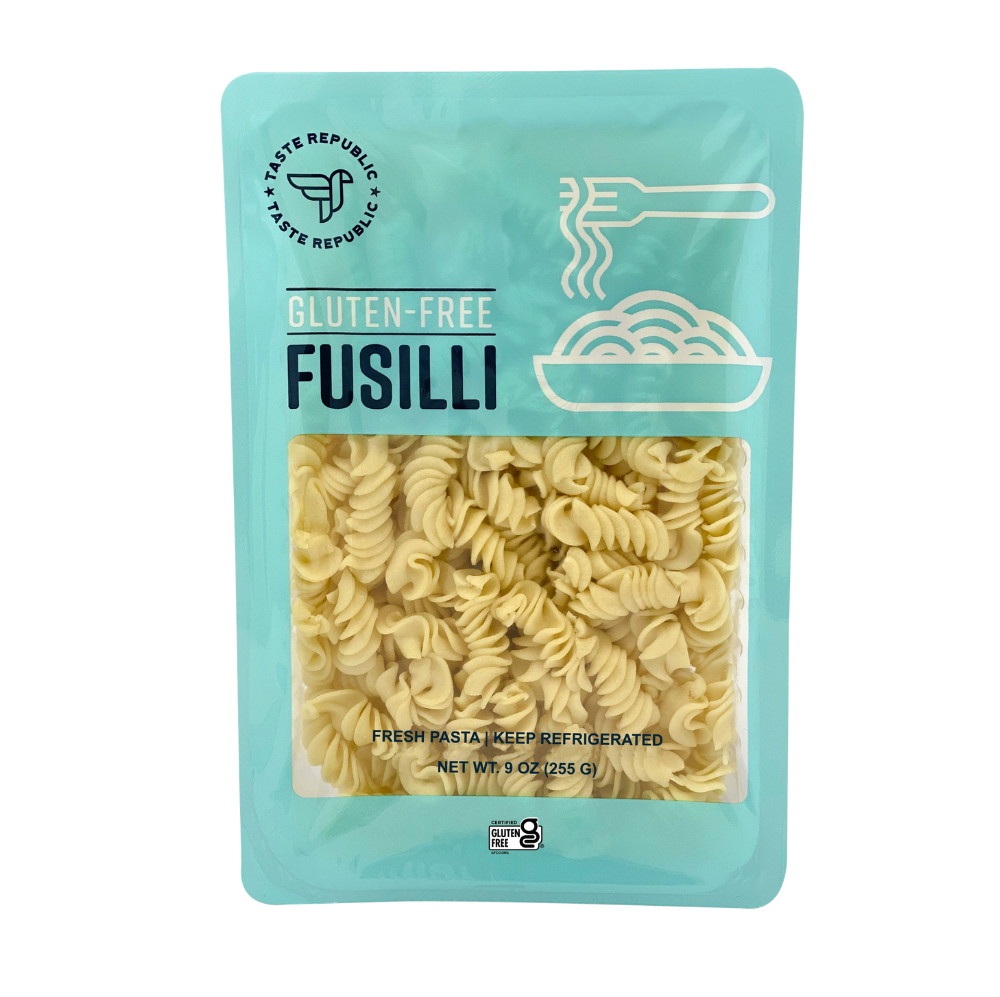 Taste Republic gluten-free fusilli pasta in a 6-pack, showcasing spiral-shaped pasta on a white background.