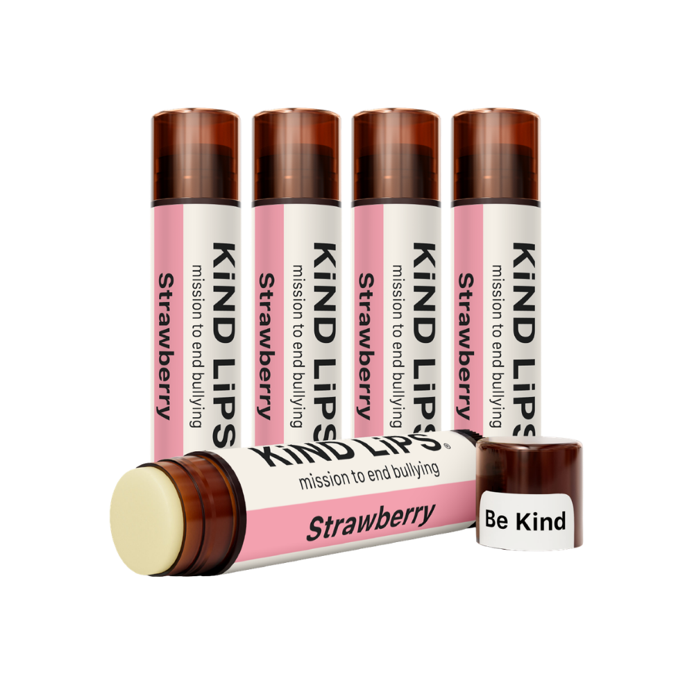 Kind Lips Strawberry Organic Lip Balm tube with clear packaging, showing the natural, nourishing balm inside.