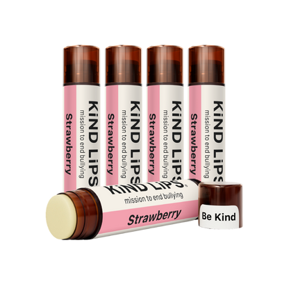 Kind Lips Strawberry Organic Lip Balm tube with clear packaging, showing the natural, nourishing balm inside.