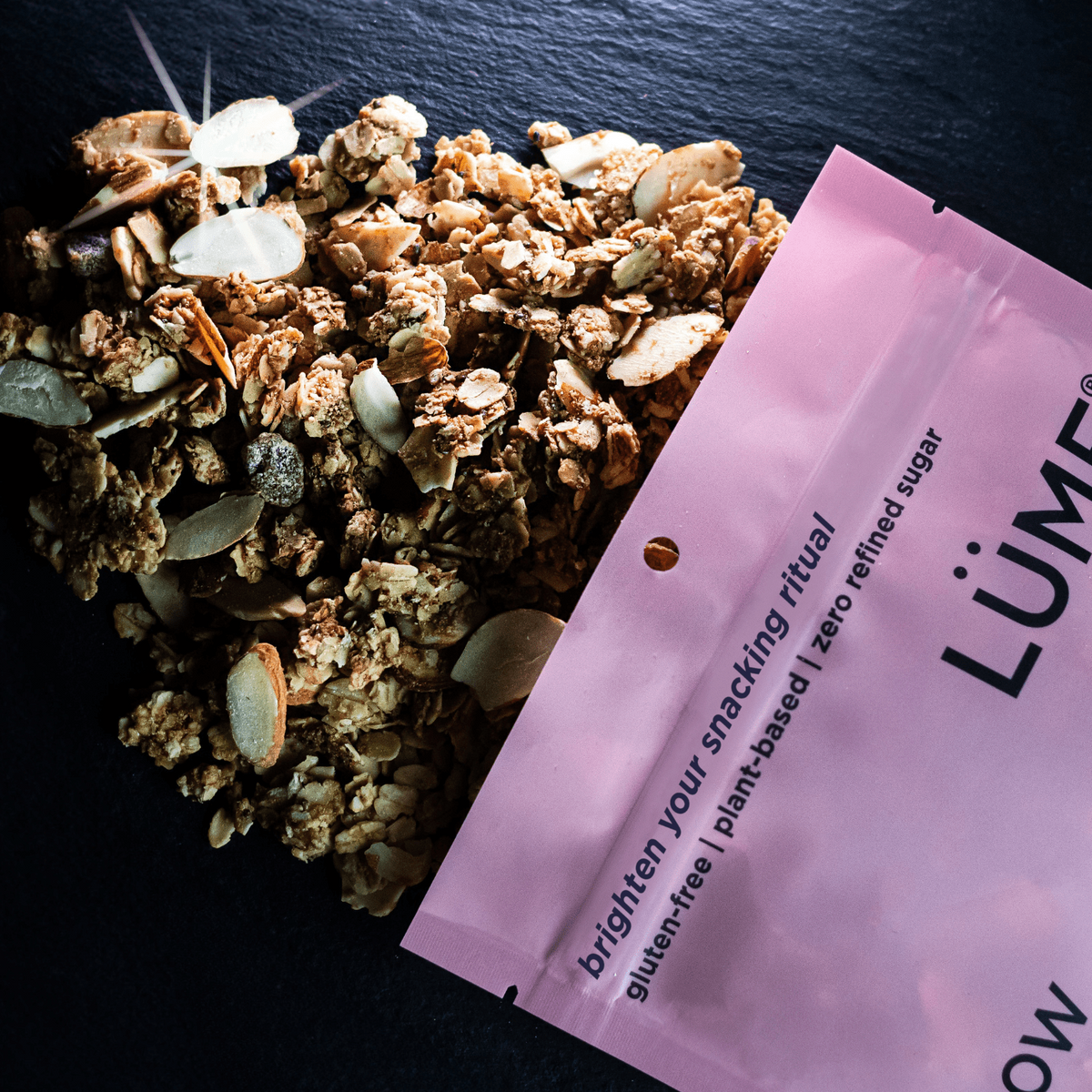 LÜME Cinnamon Almond Granola in a package with cinnamon and almond flavoring design