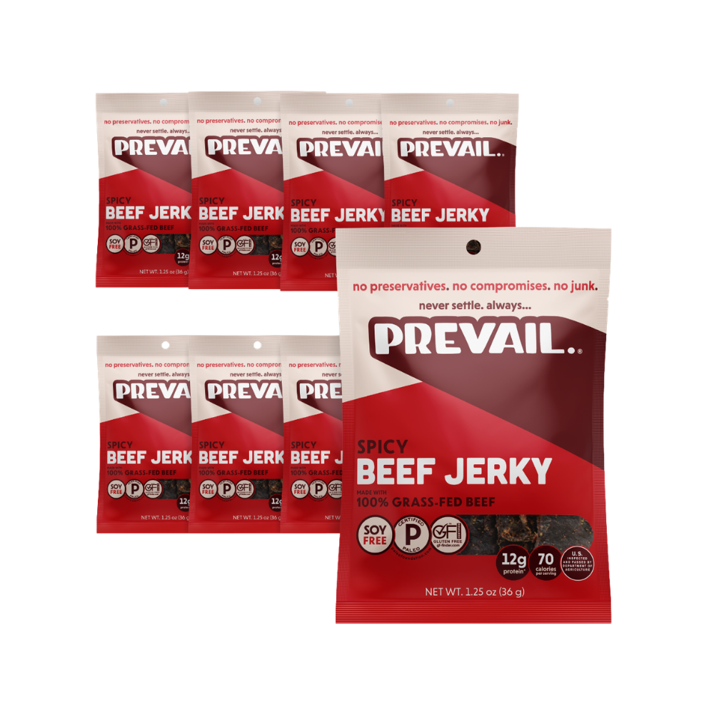 Package of PREVAIL Jerky Spicy Beef Jerky single-serve 8-pack with visible jerky pieces in clear packaging.