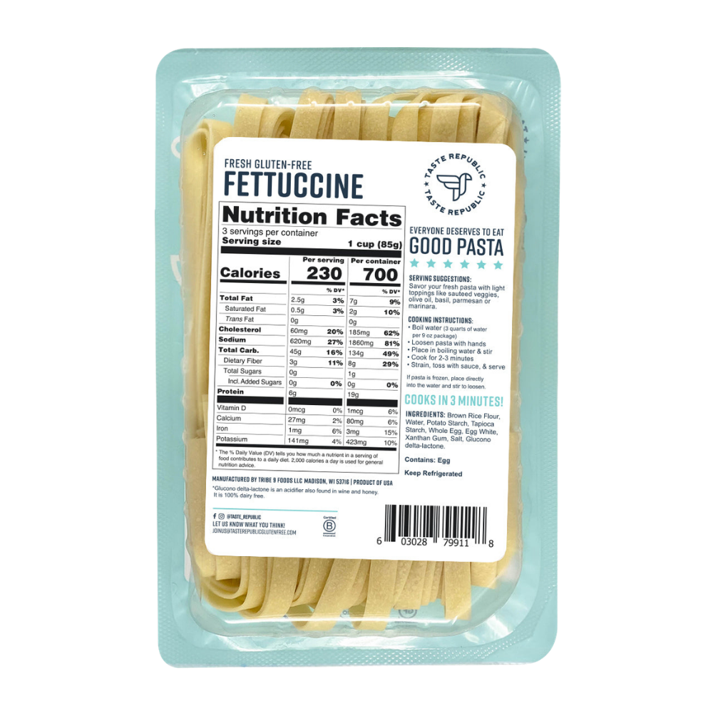 Taste Republic gluten-free fettuccine pasta in a 6-pack, showcasing uncooked, fresh, ribbon-shaped pasta on a white surface.